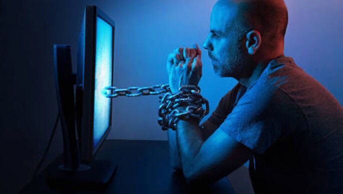 A Dude Chained to His Computer