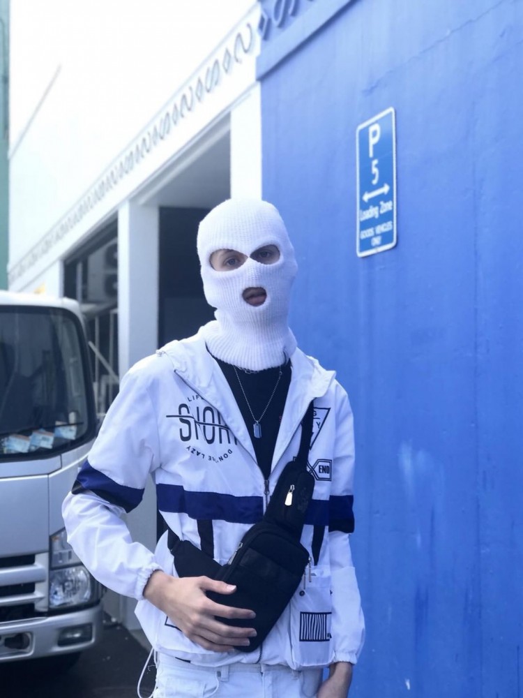 Geared up with balaclava shoulderbag and windbreaker